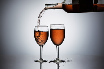 Act of pouring wine into a glass.