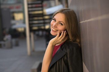 Beautiful young woman calling by phone