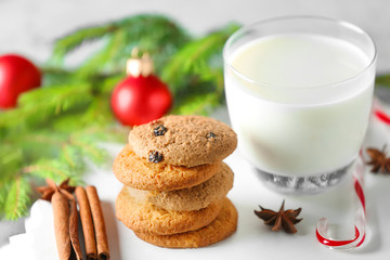 Delicious cookies and glass with milk on table