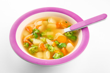 Plate of delicious baby soup, isolated on white