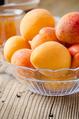 Fresh apricots in glass bowl