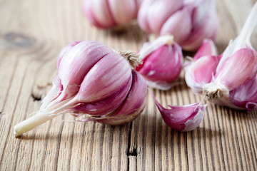Raw  garlic on wooden background