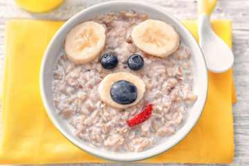 Creative oatmeal for children on table, close up