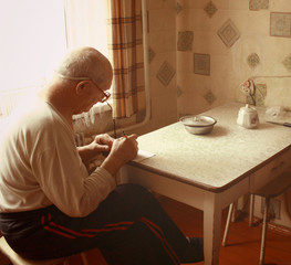 poverty old man in the kitchen