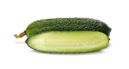 Small cucumbers, sliced in half isolated on white background