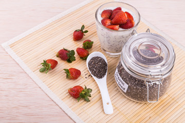 Chia seeds pudding with strawberry fruits, healthy nutritious anti-oxidant superfood.