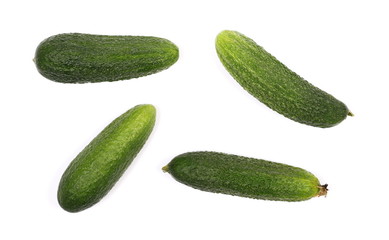 Small cucumbers isolated on white background, top view