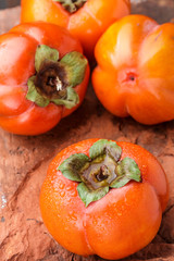 Fresh ripe persimmon with water drops. Selective focus