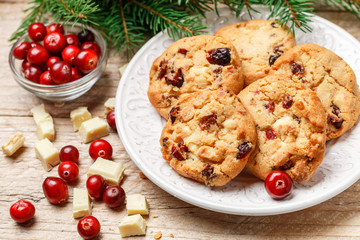 Homemade Christmas cranberry cookies with white chocolate in a bowl on the table. Rustic style. Selective focus