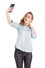 woman  taking high angle self photo or selfie with her smart phone.