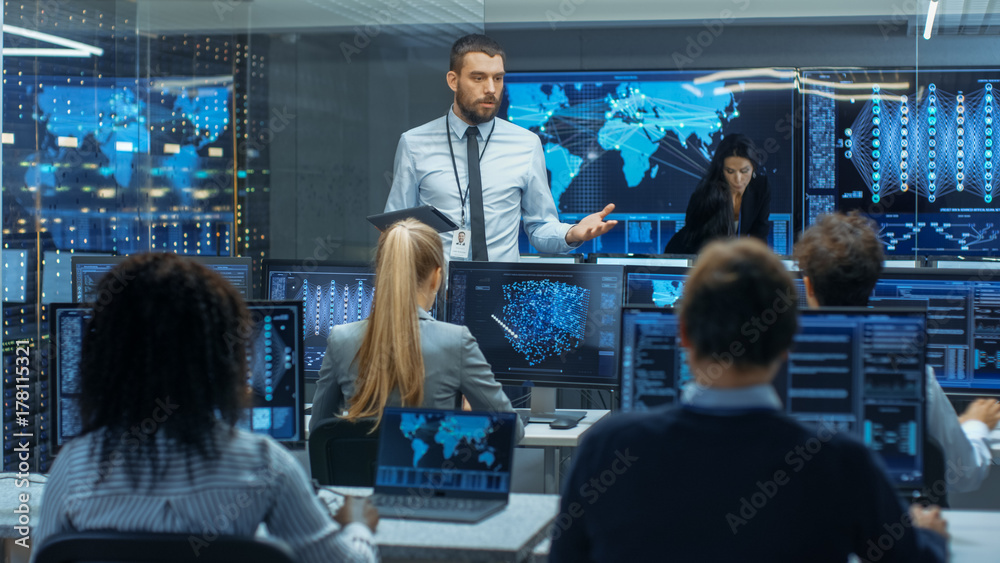 Poster Chief Project Engineer Holds Briefing for a Team of Scientists that are Building Machine Learning System. Displays Show Working Model of Neural Network.