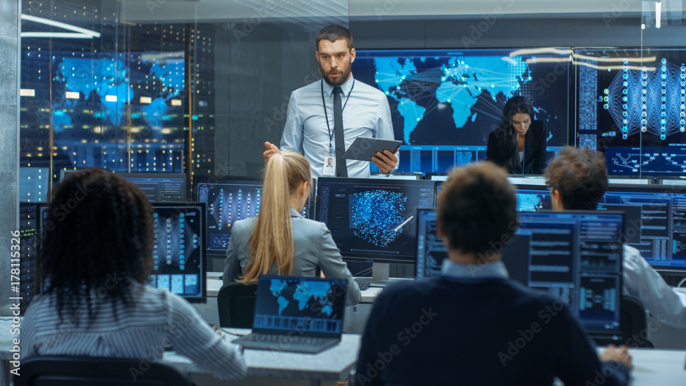 Poster Chief Project Engineer Holds Briefing for a Team of Scientists that are Building Machine Learning System. Displays Show Working Model of Neural Network.
