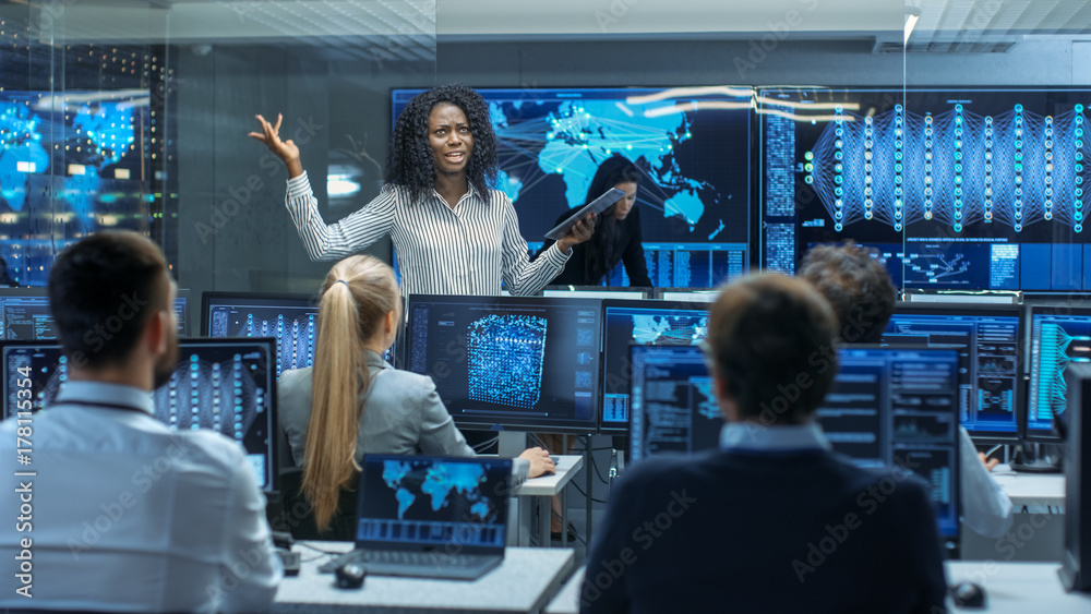 Poster Chief Project Engineer Holds Briefing for a Team of Scientists that are Building Machine Learning System. Displays Show Working Model of Neural Network.