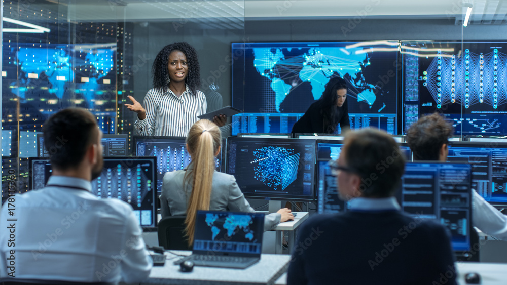 Poster Chief Project Engineer Holds Briefing for a Team of Scientists that are Building Machine Learning System. Displays Show Working Model of Neural Network.