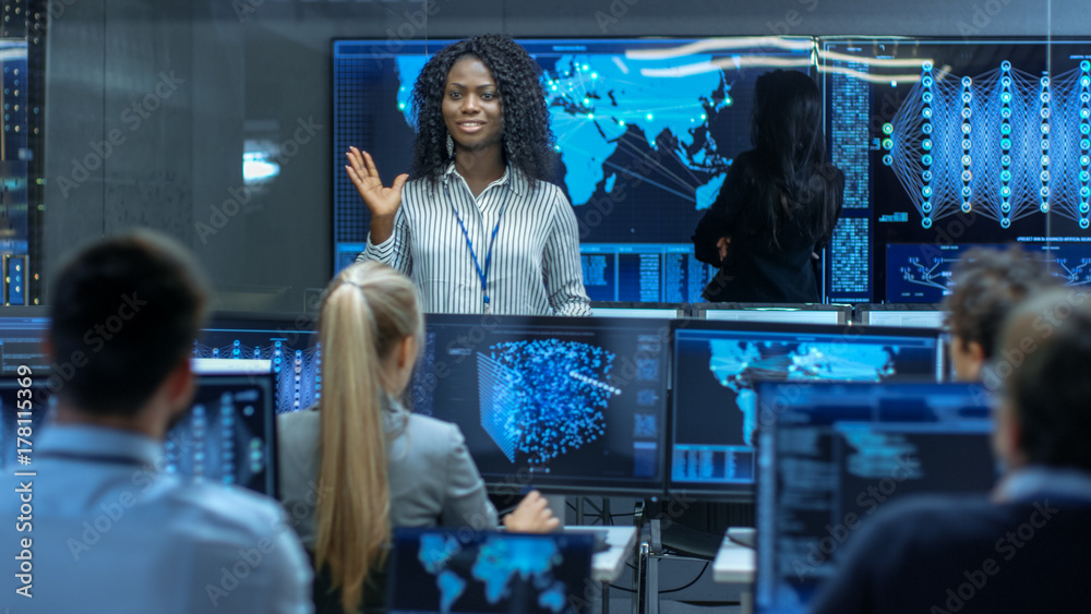 Poster Chief Project Engineer Holds Briefing for a Team of Scientists that are Building Machine Learning System. Displays Show Working Model of Neural Network.