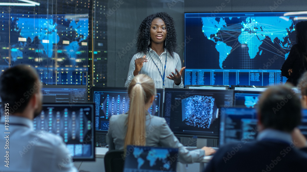 Poster Chief Project Engineer Holds Briefing for a Team of Scientists that are Building Machine Learning System. Displays Show Working Model of Neural Network.