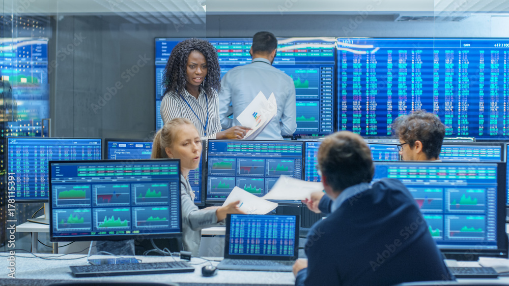 Poster multi-ethnic team of traders is busy working at the stock exchange office. dealers and brokers buy a