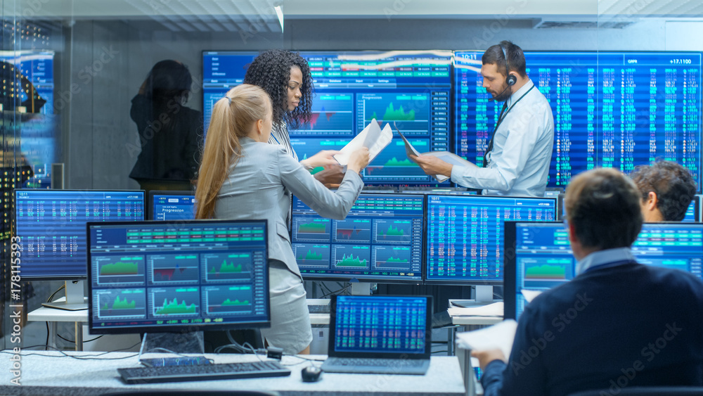 Poster multi-ethnic team of traders is busy working at the stock exchange office. dealers and brokers buy a