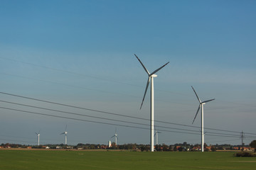 Fototapeta na wymiar Wind generator on a background of sunset sky. Clean energy concept