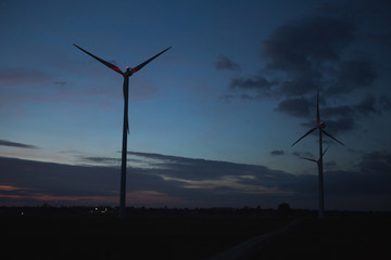 Wind turbine in the evening. Clean energy concept. 