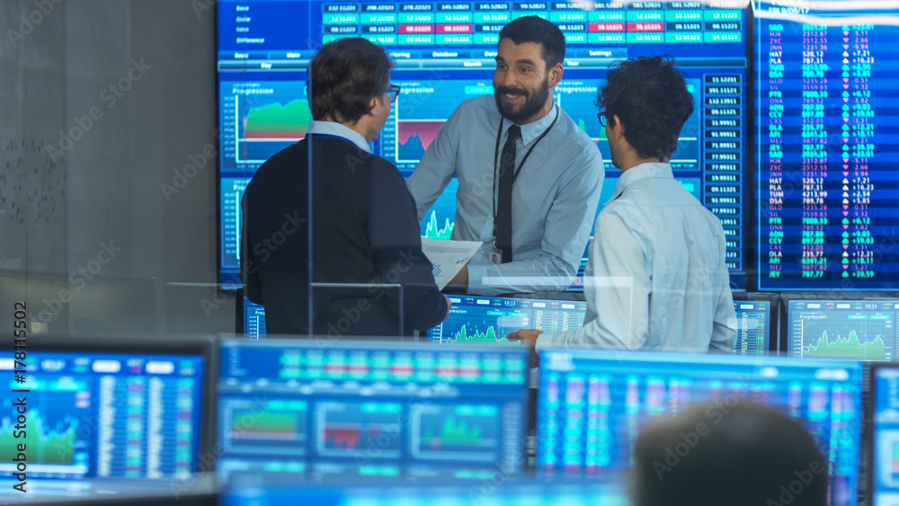 Poster three experienced stock traders talking business. they work for a big stock exchange firm. office is