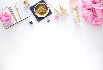 Styled desk scene with gold, navy and pink, feminine workplace