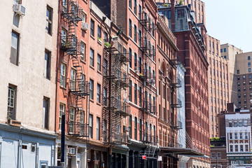 Typical old houses with facade stairs in TRibeca, NYC, USA