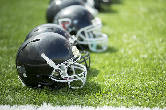 American football helmets on field