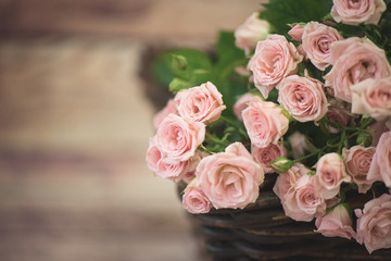 beautiful roses are in the basket