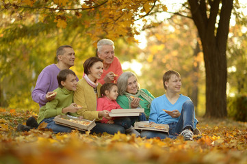 Fototapeta premium Happy family eating pizza together