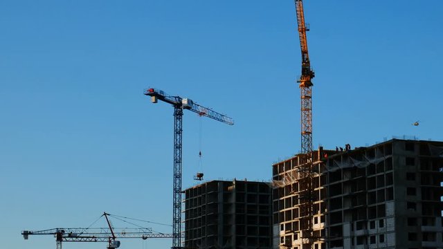 Crane lifting construction material