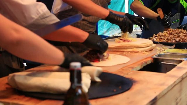 street sellers are burritos,street food