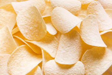 Golden Chips potato texture. Food Background of delicious chips