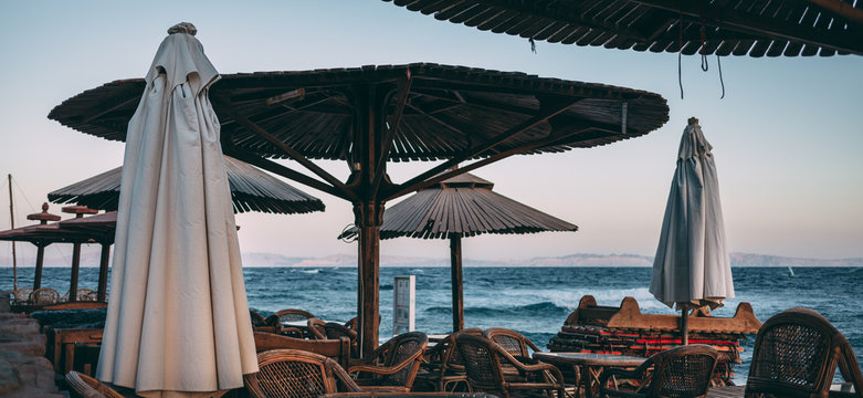Empty Dahab seaside outdoor bedouin cafe on sunset