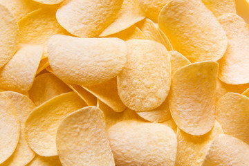 Golden Chips potato texture. Food Background of delicious chips