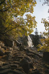 Hiking up the Mist Trail through autumn leaves in Yosemite