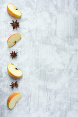 Obraz na płótnie Canvas Recipe background with four apple wedges and star anise