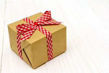 vintage gift box package on white wooden background