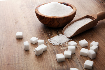 Various types of sugar, white sugar on wooden table.