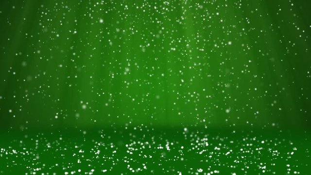 Snow fall and settle on the surface. Green winter background as place for advertisement or logo, Christmas or New Year cards. Seamless looped background with DOF, copy space, light rays 1