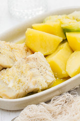 boiled cod fish with potato on dish