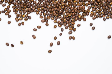 Flay lay style, Medium dark Roasted peaberry coffee beans isolated on white background with copy space for text.