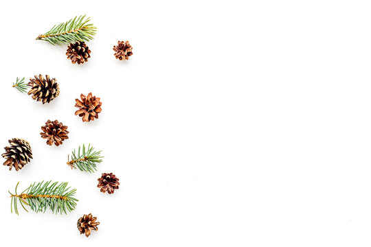 New year symbols pattern. Spruce branches and cones on white background top view copyspace