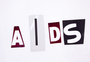 A word writing AIDS made of different magazine newspaper letter magazine different letters for health concept