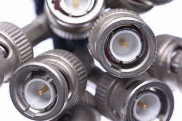 Obraz premium Closeup of bunch bnc connectors isolated on white background
