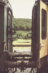 platform between two old train cars in belgium