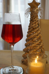 Christmas tree, candle and glass of wine