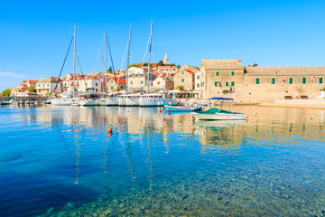 Fototapeta na wymiar View of Primosten port with sailing boats, Dalmatia, Croatia