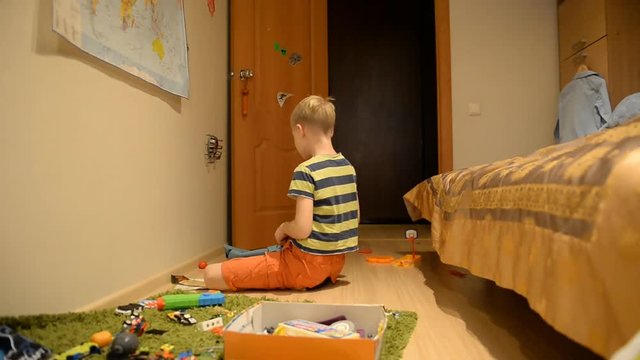 A Boy Of 8 Years Old, A Strict Dad And Toys In An Ordinary Home Setting 