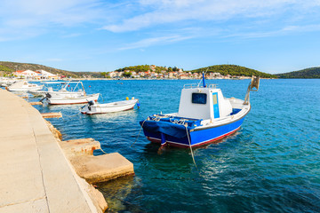 Fishing boats on blue sea in Rogoznica port, Dalmatia, Croatia